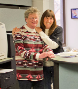Shirley Sandoval and Glenda Johnson pose in Building 2. They have a combined 68 years at DMACC.