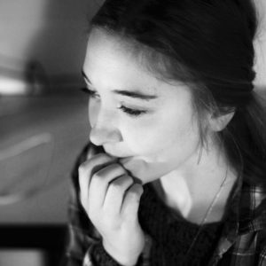 Anna Stegall, Liberal Arts major, bites her nails while under stress. Photo illustration by PJ Graham